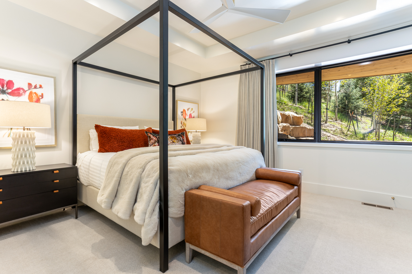 Canopy queen bed with hillside view