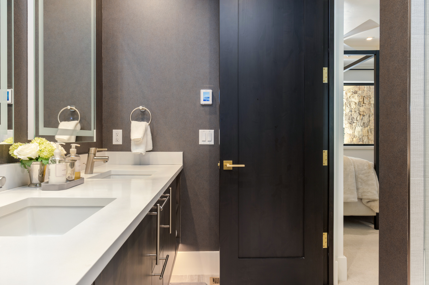 Vanity with bedroom beyond