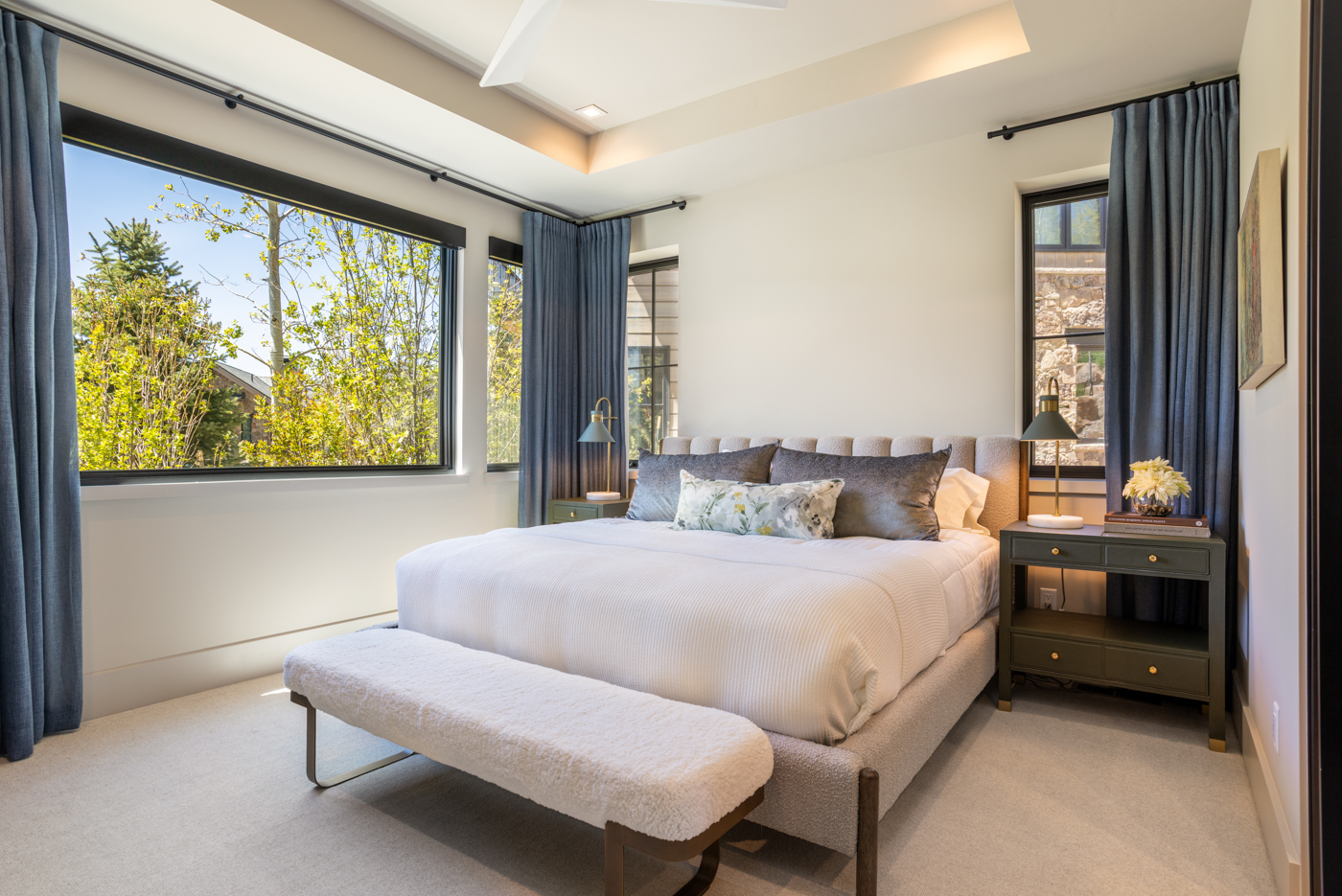 King bed with treetop window views