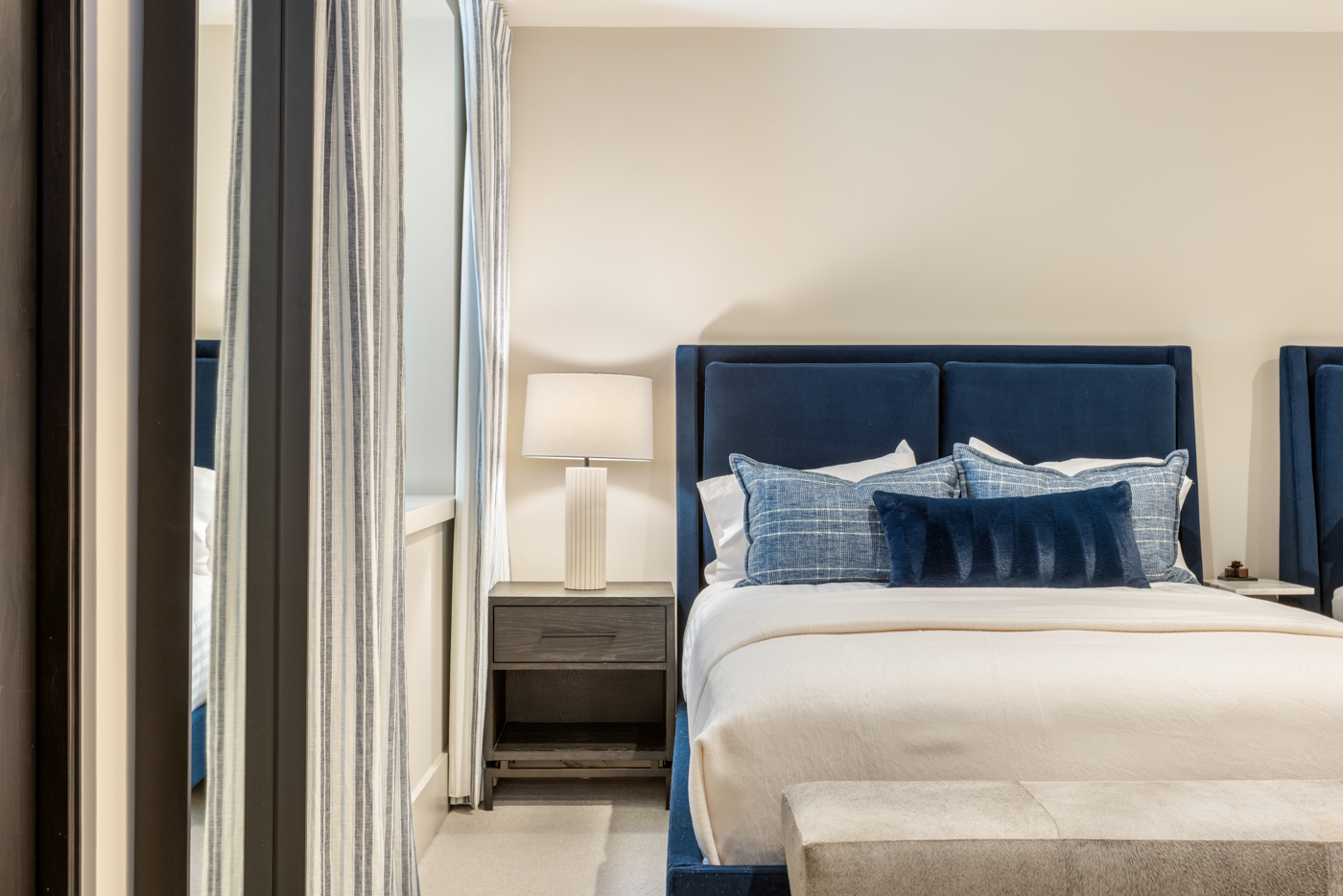 Bedside detail with linen lamp